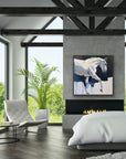 Modern bedroom with a painting of a horse on the wall, a fireplace, and a view of greenery outside.