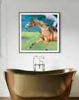 Framed painting of a polo player on a horse above a gold bathtub.
